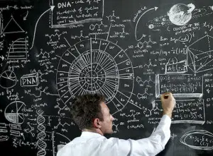 teacher writing equations on the black board